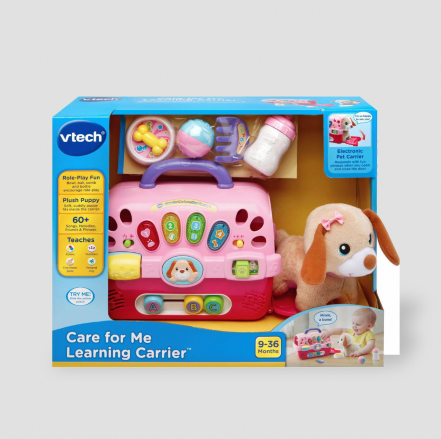 Boîte d'emballage bleue VTech Care for Me Learning Carrier montrant le transporteur rose et les accessoires