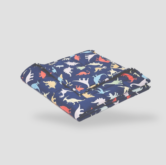 Folded navy dinosaur print kids weighted blanket on white background, product view