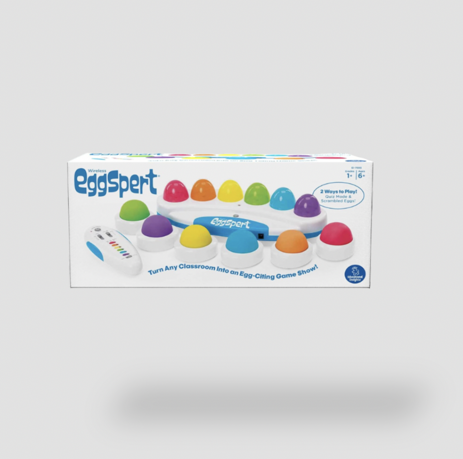 Boîte d'emballage commerciale du jeu de buzzer pour salle de classe Educational Insights Wireless Eggspert montrant la base avec boutons œufs arc-en-ciel et la télécommande sans fil, dès 6 ans
