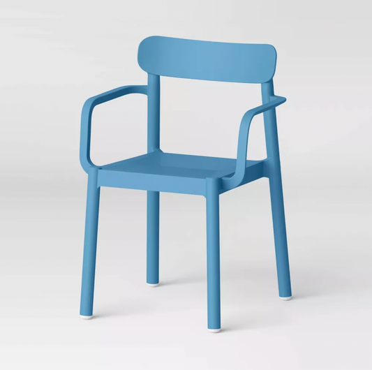 Blue plastic Elba stacking dining chair with armrests and curved back, three-quarter view
