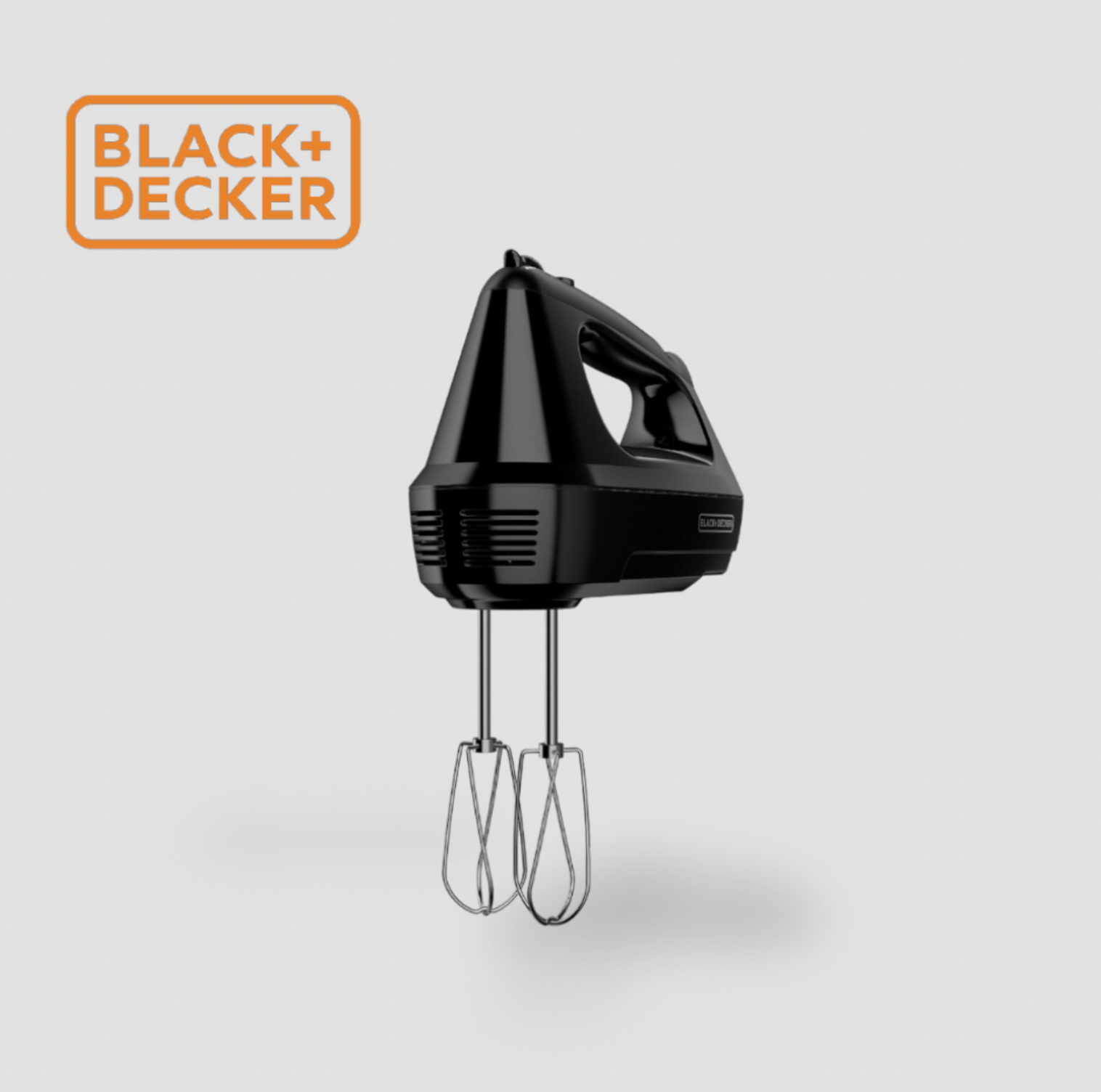 Side view of black BLACK+DECKER hand mixer with stainless steel beaters and side ventilation grille
