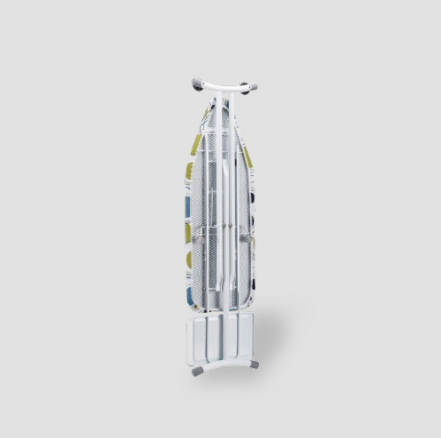 Ironing board folded upright on its stand showing perforated metal underside