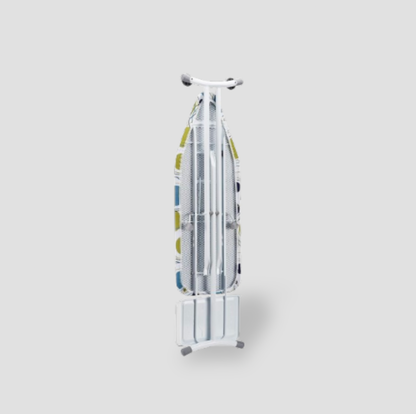 Ironing board folded upright on its stand showing perforated metal underside