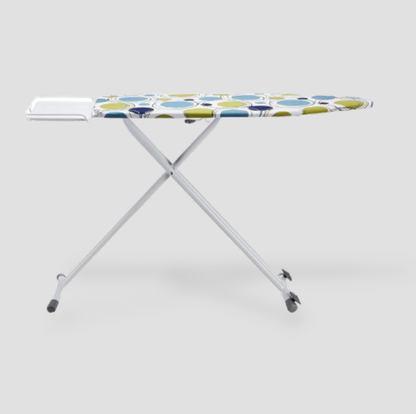 Side view of ironing board with X-frame legs and rolling rear caster wheels