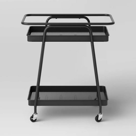 Front view of black metal mesh utility cart with two open shelves and wheels