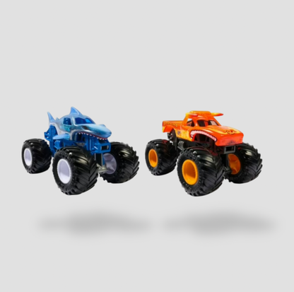 Blue Megalodon shark monster truck and orange El Toro Loco bull monster truck three-quarter view