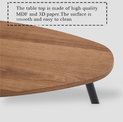 Gros plan du bord du plateau ovale au grain noyer et du pied métallique noir de la table basse, mention table top is made of high quality MDF and 3D paper
