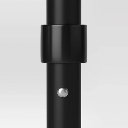 Close-up of black patio umbrella pole with collar joint and silver push-pin lock