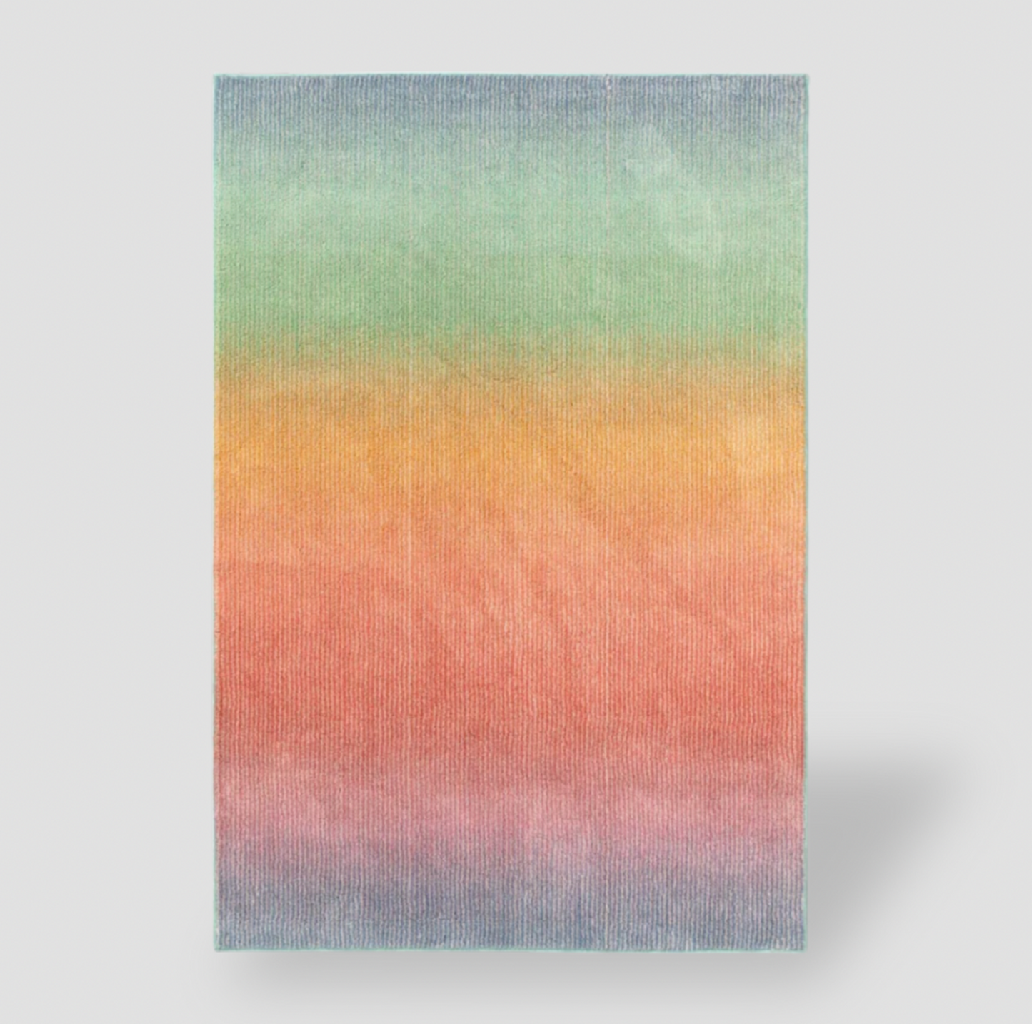 Tapis pour enfants touffeté rectangulaire en dégradé arc-en-ciel avec bandes horizontales bleu, vert, orange, rouge et rose, vue de dessus