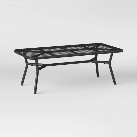 Black metal mesh rectangular patio coffee table with X-brace and splayed legs, three-quarter view