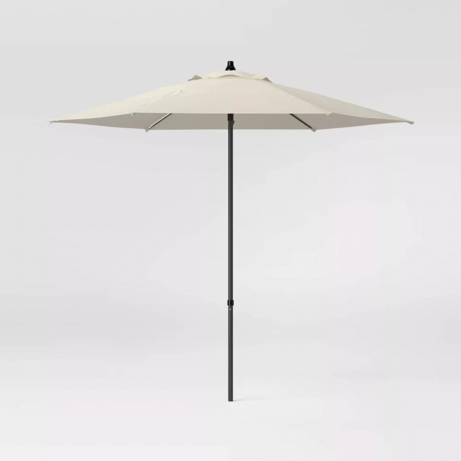 Room Essentials beige round patio umbrella with black pole and crank, full product front view
