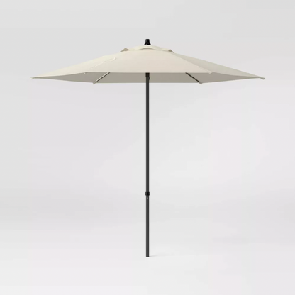 Room Essentials beige round patio umbrella with black pole and crank, full product front view