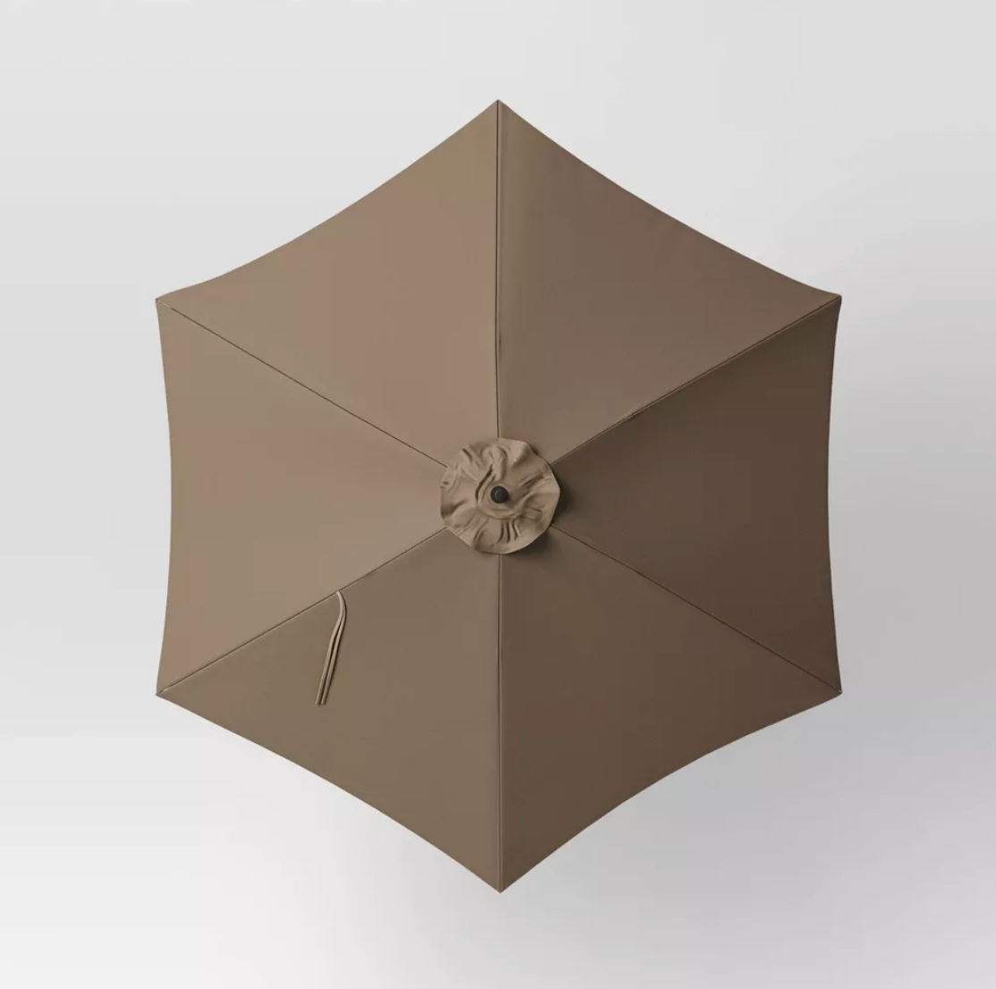 Top-down view of brown hexagon patio umbrella canopy with six panels and center vent cap