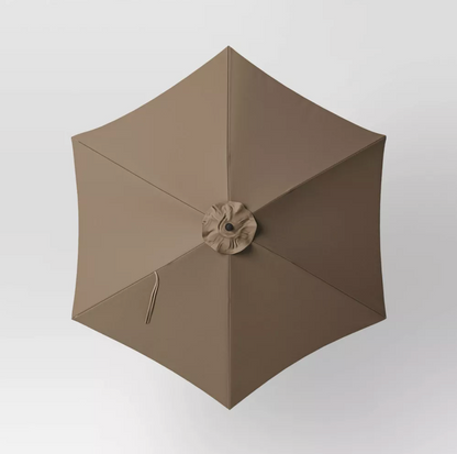Top-down view of brown hexagon patio umbrella canopy with six panels and center vent cap