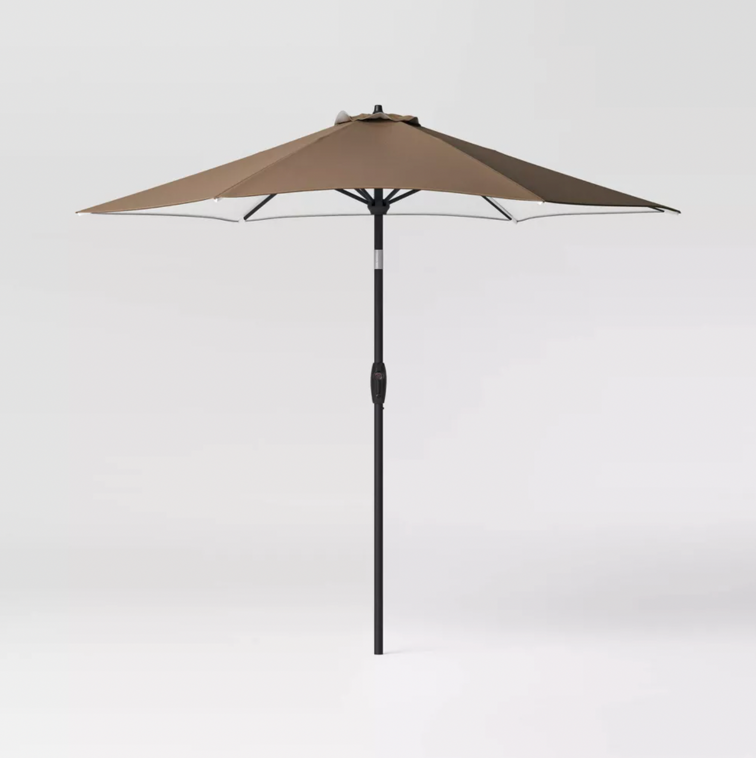Brown 9 foot round patio umbrella with black pole and tilt crank, three-quarter view