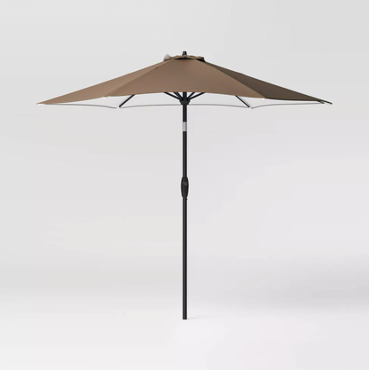 Brown 9 foot round patio umbrella with black pole and tilt crank, three-quarter view