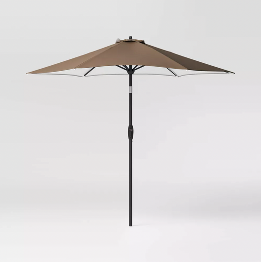 Brown 9 foot round patio umbrella with black pole and tilt crank, three-quarter view