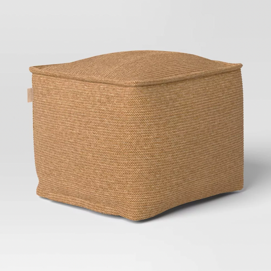 Tan knit square pouf ottoman with woven texture, three-quarter product view