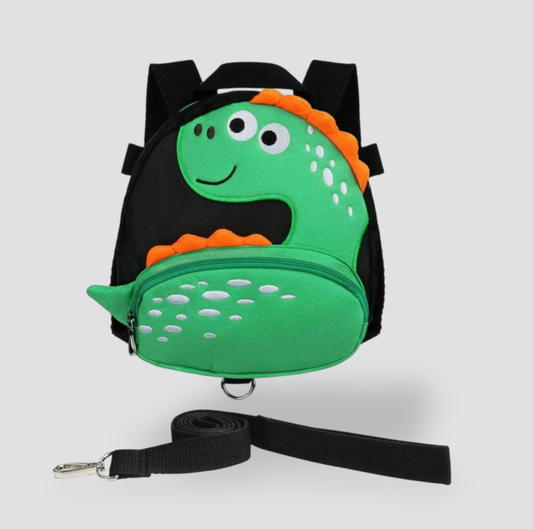 Sac à dos pour tout-petit dinosaure vert avec garniture noire et laisse de sécurité noire détachable, vue de face