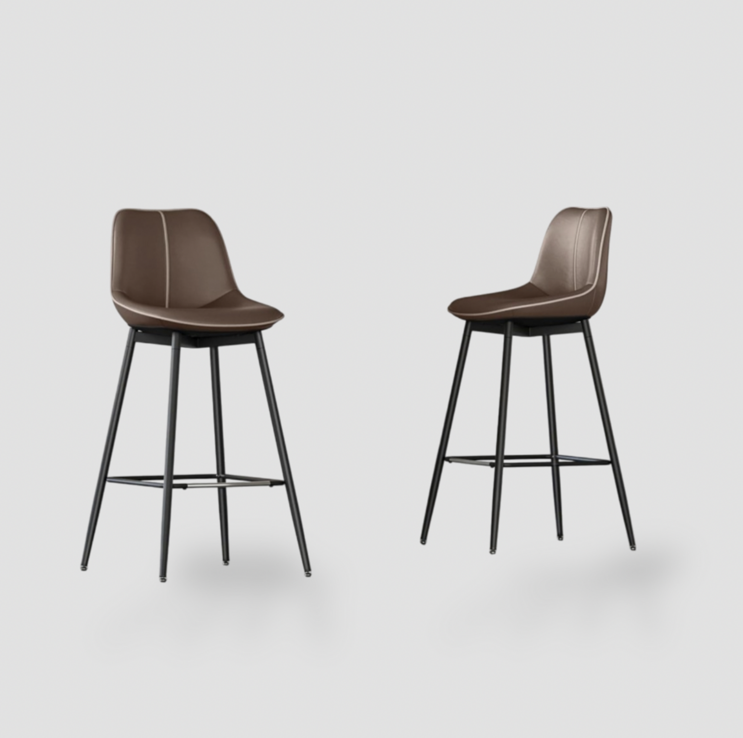 Pair of coffee brown synthetic leather bar stools with curved backrest, contrast piping and black metal four-leg base with footrest