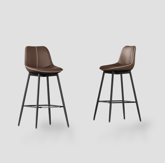 Pair of coffee brown synthetic leather bar stools with curved backrest, contrast piping and black metal four-leg base with footrest