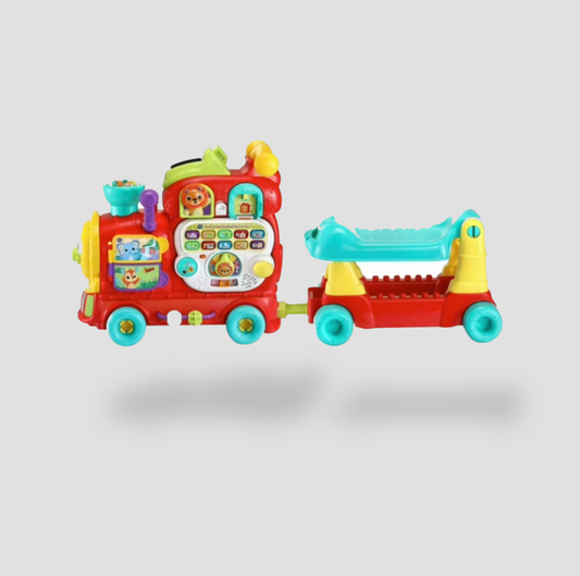 VTech 4-in-1 Learning Letters Train in red with teal and yellow accents and pull-along wagon, side view